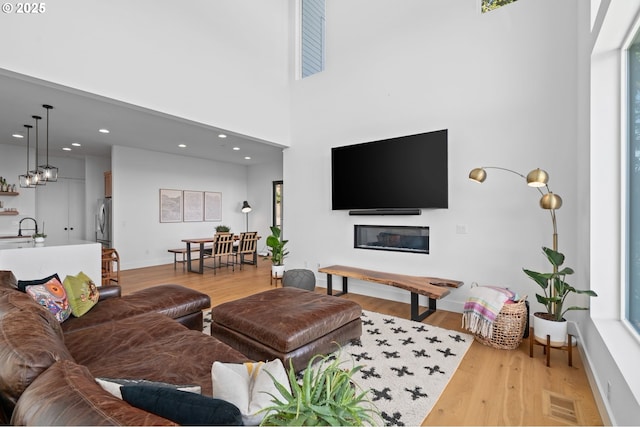 9316 NW Hardy Ave, Portland, OR 97231 - living room with light wood-style floors, baseboards, recessed lighting, and plenty of natural light