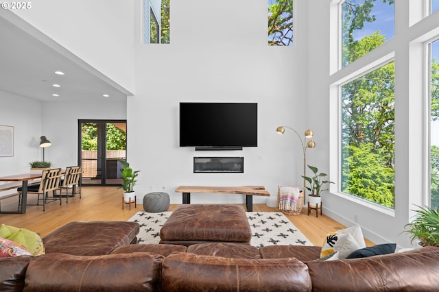 9316 NW Hardy Ave, Portland, OR 97231 - living room with a high ceiling, plenty of natural light, wood finished floors, and recessed lighting