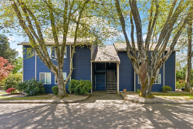 view of front of home featuring stairway