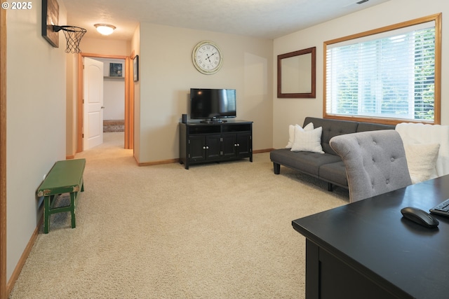 living room with light colored carpet and baseboards