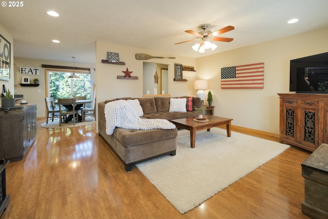 living room with recessed lighting, wood finished floors, baseboards, and ceiling fan