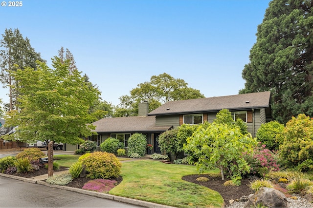 20060 SW Clarion St, Beaverton, OR 97003 - split level home with a chimney, a front lawn, and a shingled roof