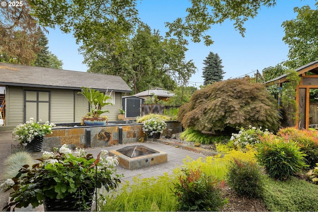 20060 SW Clarion St, Beaverton, OR 97003 - view of yard featuring a fire pit, a storage shed, and a patio area