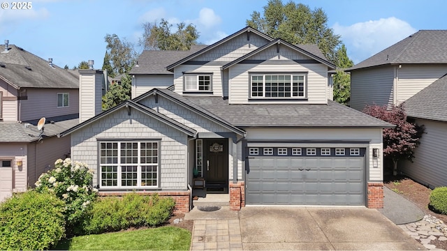 3753 NW Talamore Ter, Portland, OR 97229 - view of front of property featuring driveway, roof with shingles, brick siding, and an attached garage