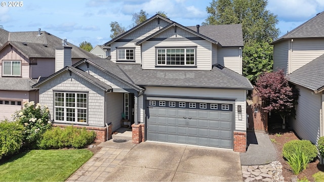 3753 NW Talamore Ter, Portland, OR 97229 - view of front of house featuring driveway, roof with shingles, a garage, and brick siding