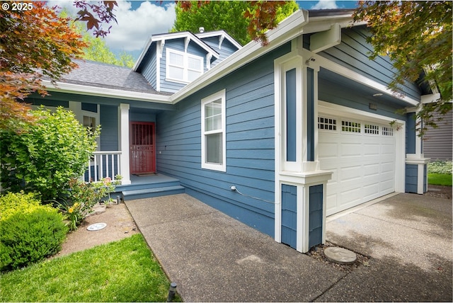 exterior space featuring a porch and a garage