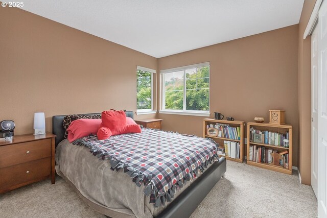 carpeted bedroom featuring a closet