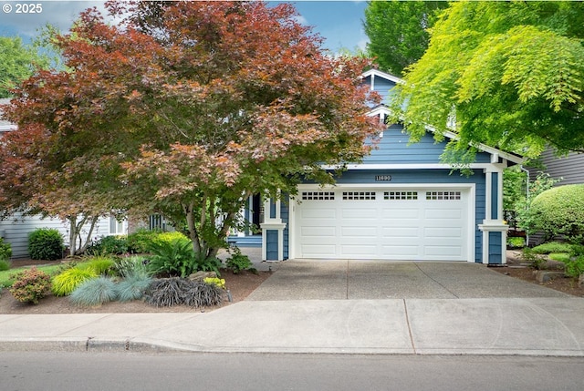 obstructed view of property featuring a garage and driveway