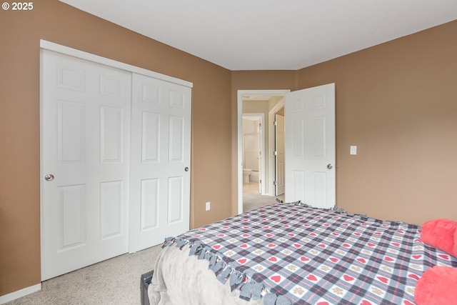 carpeted bedroom with a closet