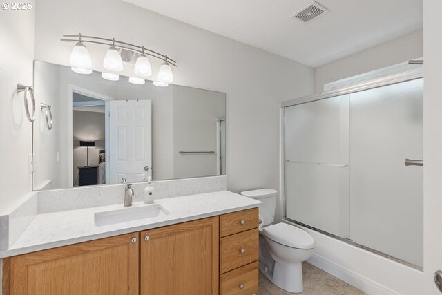 full bath with enclosed tub / shower combo, toilet, visible vents, and vanity