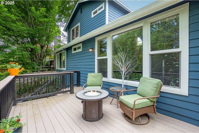deck with an outdoor fire pit
