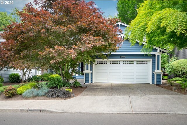 exterior space featuring a garage and a yard