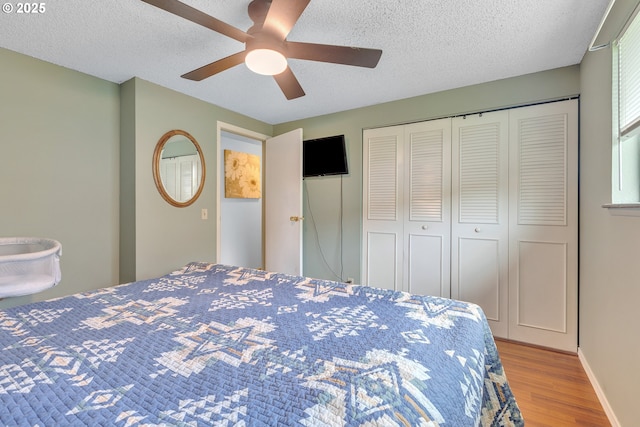 1592 NW Keasey St, Roseburg, OR 97471 - bedroom with baseboards, a closet, a textured ceiling, and wood finished floors
