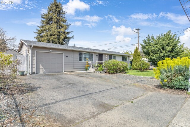 1592 NW Keasey St, Roseburg, OR 97471 - ranch-style house featuring an attached garage and driveway