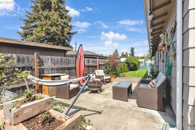 1592 NW Keasey St, Roseburg, OR 97471 - view of patio featuring an outdoor fire pit and fence