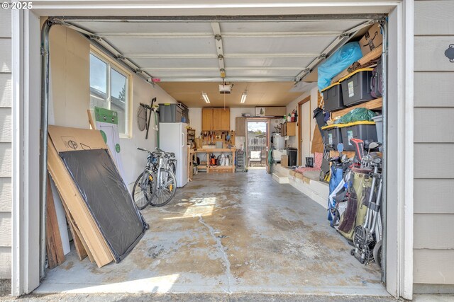 1592 NW Keasey St, Roseburg, OR 97471 - garage with a garage door opener and freestanding refrigerator