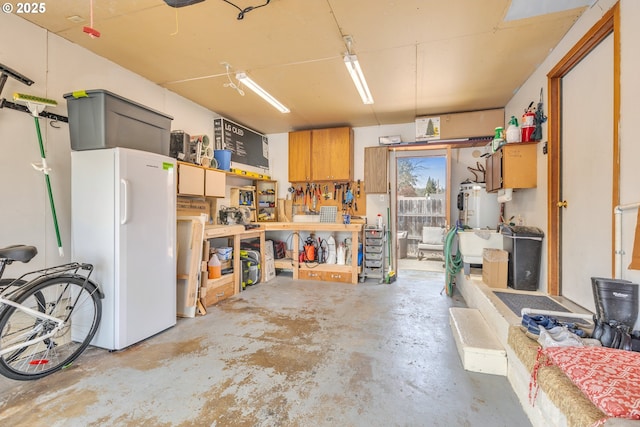 1592 NW Keasey St, Roseburg, OR 97471 - garage featuring water heater and freestanding refrigerator