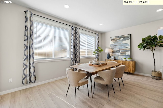 dining space with light wood-type flooring