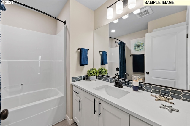 full bathroom featuring vanity, shower / bathtub combination with curtain, and toilet