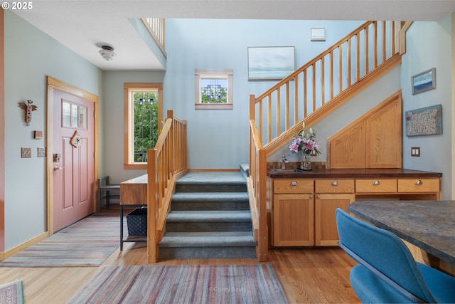 9180 Windward Ln, Manzanita, OR 97130 - entrance foyer with stairs and light wood-style floors