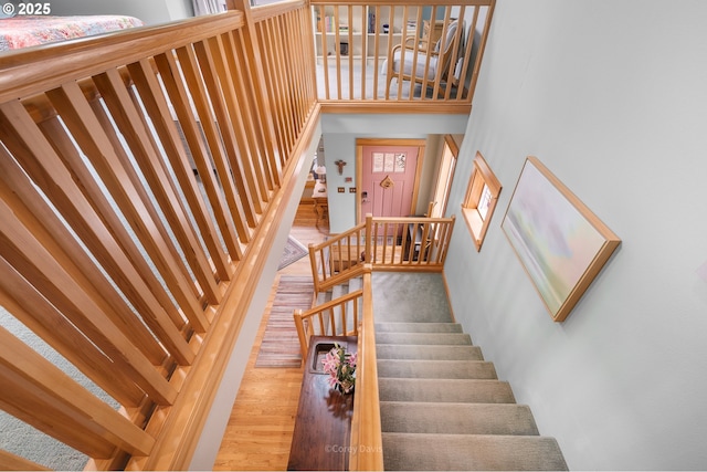 9180 Windward Ln, Manzanita, OR 97130 - staircase with wood finished floors and a high ceiling