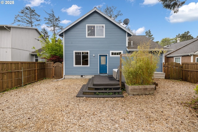 9180 Windward Ln, Manzanita, OR 97130 - back of house featuring a fenced backyard, a deck, and a gate