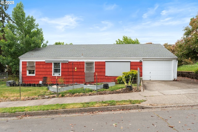 2795 Potter St, Eugene, OR 97405 - ranch-style house featuring concrete driveway, a garden, a garage, and a shingled roof