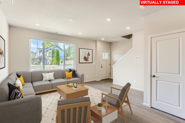 11329 NW Main St, North Plains, OR 97133 - living area with baseboards, recessed lighting, a textured ceiling, and light wood-type flooring
