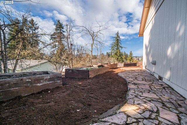 view of yard featuring a garden and fence