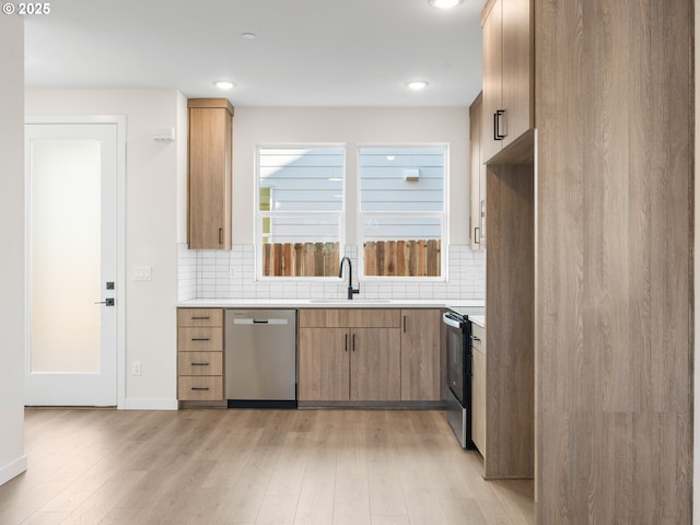 kitchen with tasteful backsplash, stainless steel dishwasher, sink, and electric range oven