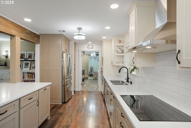 30596 Horseshoe Dr, Albany, OR 97321 - kitchen featuring black electric cooktop, a sink, wall chimney range hood, visible vents, and stainless steel fridge with ice dispenser