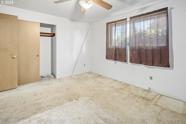 unfurnished bedroom with a closet and a ceiling fan