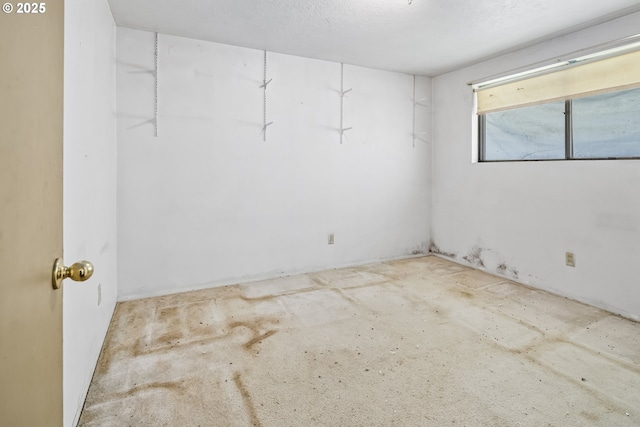 empty room featuring unfinished concrete flooring