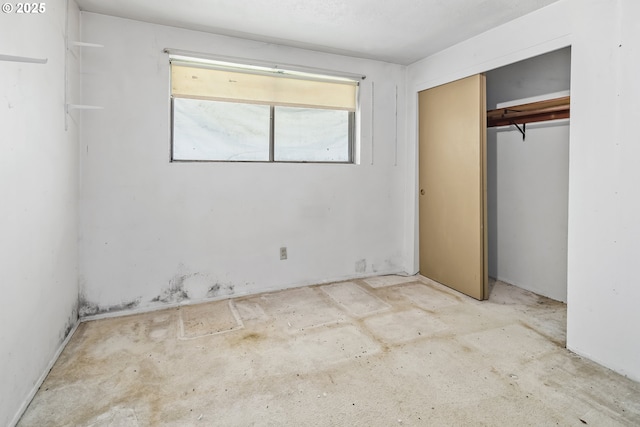 unfurnished bedroom featuring a closet