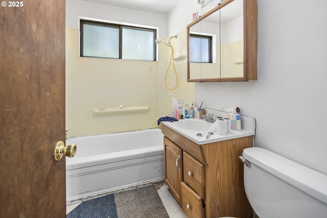 full bath featuring toilet, vanity, and shower / washtub combination