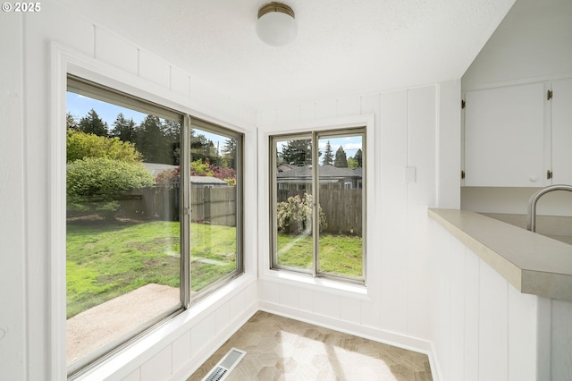 unfurnished dining area featuring visible vents