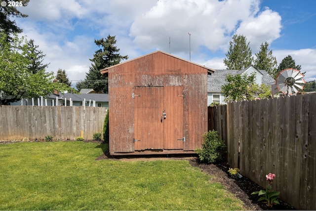 view of shed with a fenced backyard