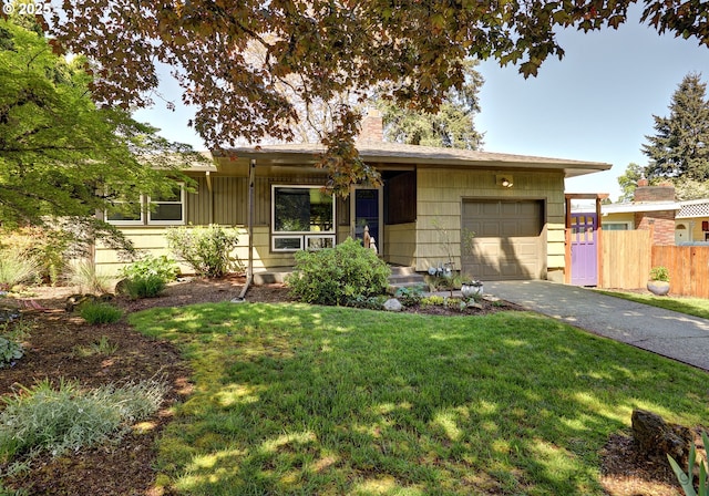 view of front of property with fence, an attached garage, a front lawn, aphalt driveway, and a chimney