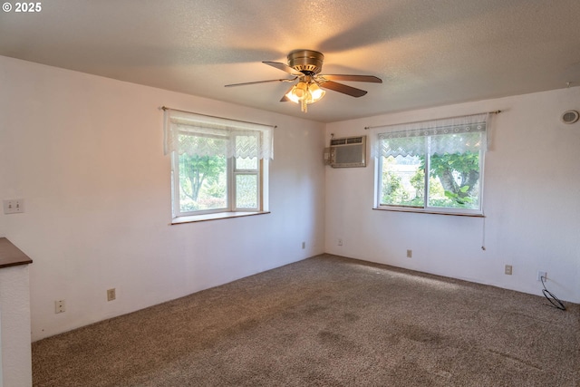 471 Hawthorne St, Sutherlin, OR 97479 - unfurnished room featuring a wall unit AC, carpet flooring, healthy amount of natural light, a ceiling fan, and a textured ceiling