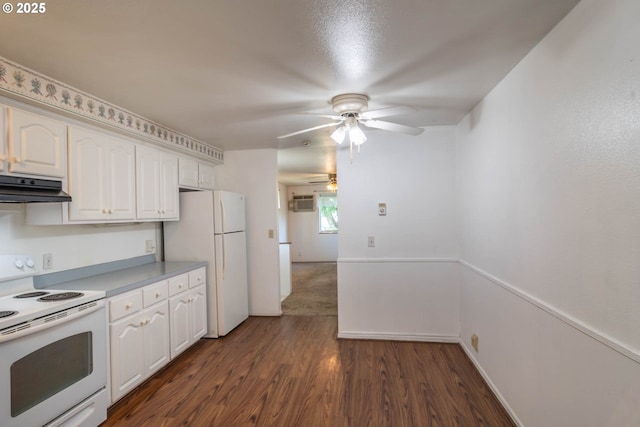 471 Hawthorne St, Sutherlin, OR 97479 - kitchen featuring white appliances, under cabinet range hood, ceiling fan, dark wood-style floors, and white cabinetry