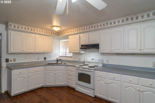 471 Hawthorne St, Sutherlin, OR 97479 - kitchen with white electric range, a sink, a skylight, under cabinet range hood, and white cabinets