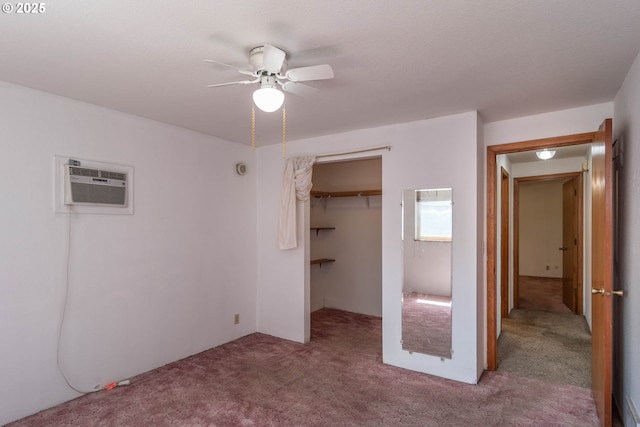 471 Hawthorne St, Sutherlin, OR 97479 - unfurnished bedroom featuring carpet, a wall mounted AC, a closet, and ceiling fan