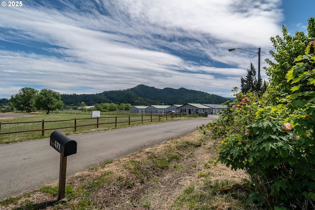 471 Hawthorne St, Sutherlin, OR 97479 - view of asphalt road with a mountain view and street lights