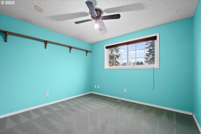 unfurnished room with visible vents, baseboards, carpet flooring, a textured ceiling, and a ceiling fan