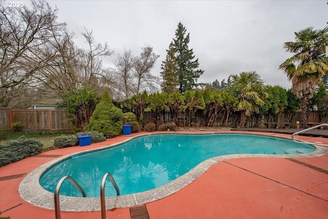 view of swimming pool with a fenced in pool, a patio, and a fenced backyard