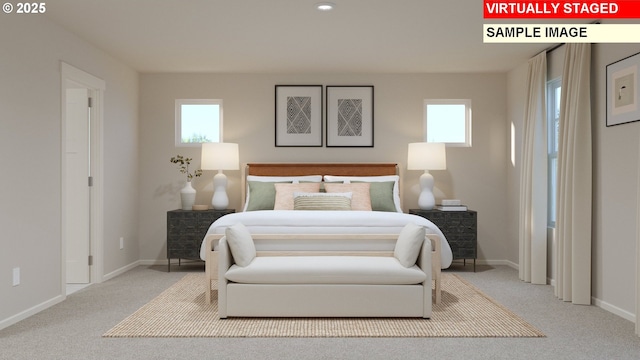 carpeted bedroom featuring multiple windows and baseboards