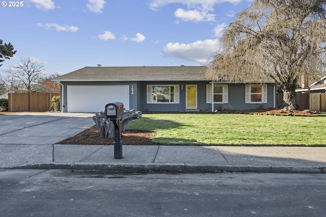 single story home featuring a garage and a front yard