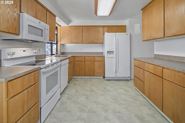 kitchen with white appliances and sink