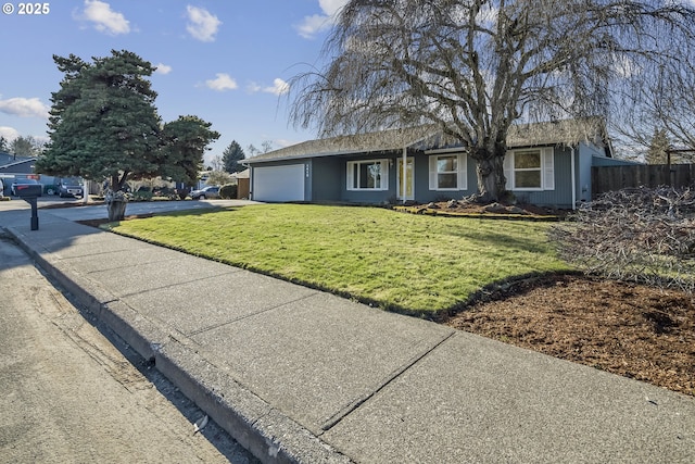 single story home with a garage and a front yard