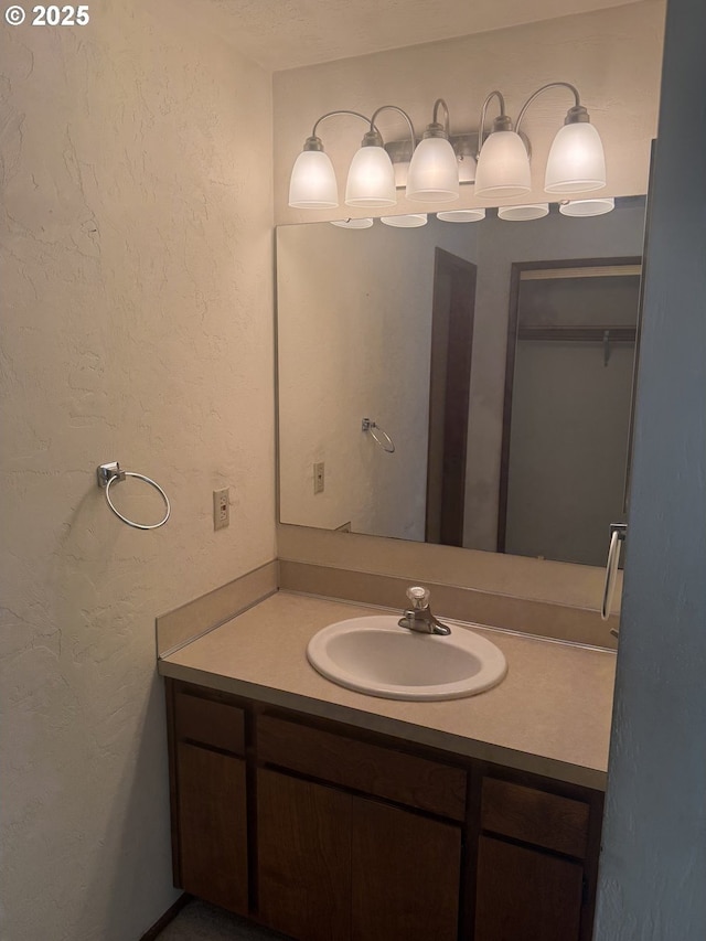 2040 40th St, Florence, OR 97439 - bathroom featuring vanity and a textured wall